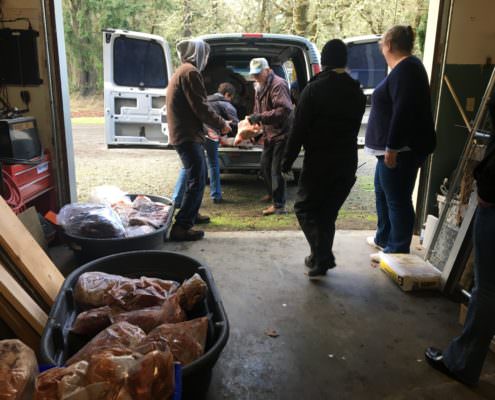 Wolf Haven staff unloading the gift of meat